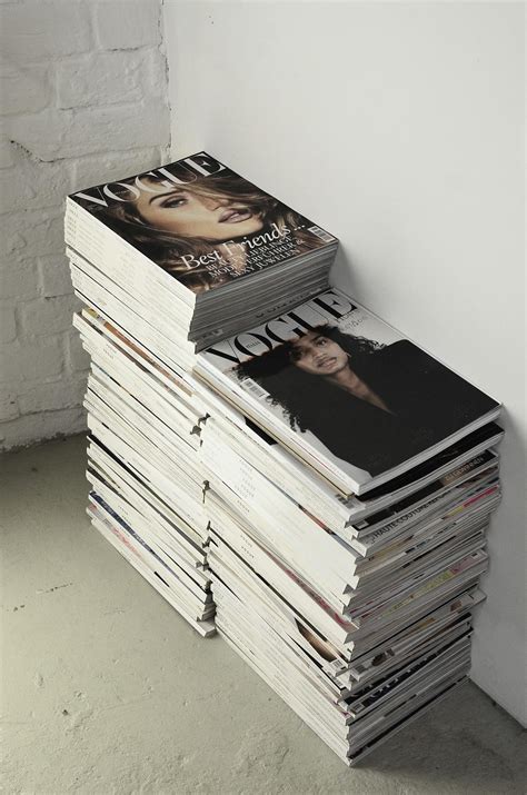 Stack of fashion magazines on floor · Free Stock Photo