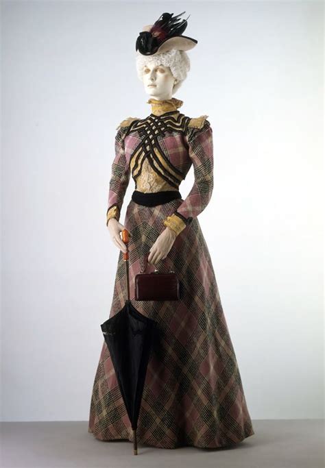 Costume in wool check France c.1897 Wool, trimmed with ribbon, braid and machine-made lace ...