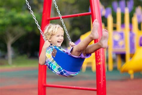 Child on Playground. Swing Kids Play Outdoor Stock Image - Image of ...