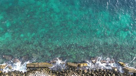 aerial view of pebble beach with blue sea 33837297 Stock Video at Vecteezy