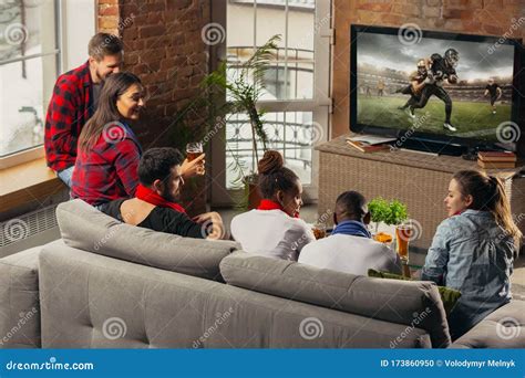 Excited Group of People Watching Sport Match at Home Stock Photo ...