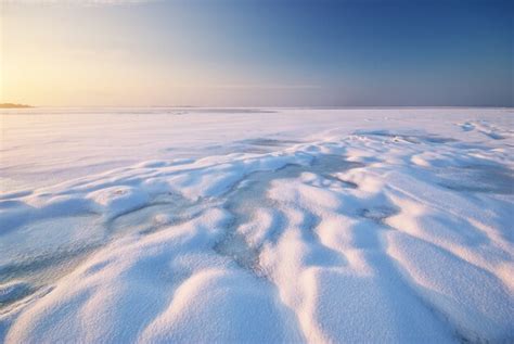 Premium Photo | Field covered with snow and ice landscape