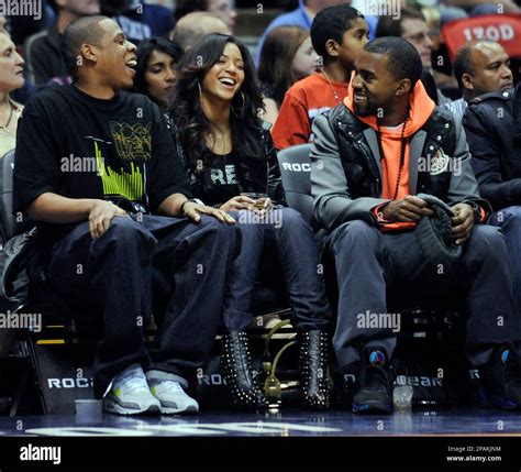 Entertainers Jay-Z, left, Beyonce and Kanye West, right, laugh during ...