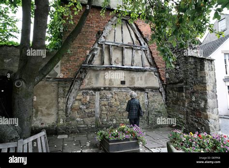 A wooden cruck remaining from the demolition of an old medieval building, High Street ...