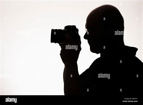 silhouette of a man with a camera Stock Photo - Alamy