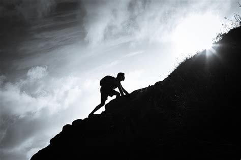 Man Climbing Up A Mountain Stock Photo - Download Image Now - Moving Up ...