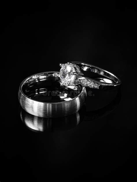 Two Weddings Rings on Black Background Stock Photo - Image of fashion ...