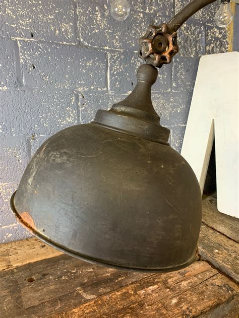 A rusty black metal adjustable vintage industrial floor lamp - Belle and Beast Emporium
