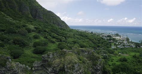 Aerial Footage Of The Green Lush Mountain By The Blue Sea · Free Stock Video