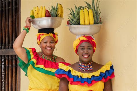 Cheerful fresh fruit street vendors aka Palenqueras in the Old Town of ...