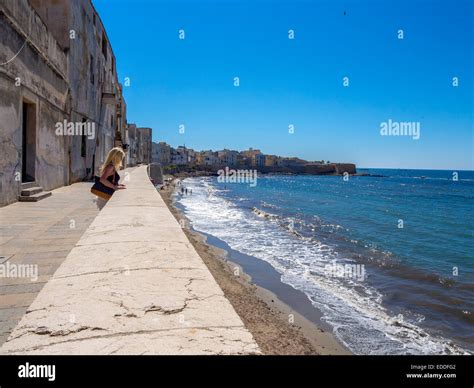 Italy, Sicily, Province of Trapani, Trapani, Old town, Via Mura di Tramontana Ovest, woman ...