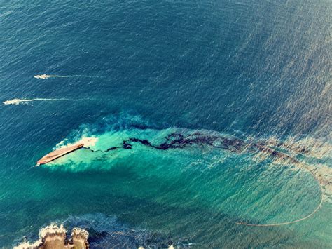 Trinidad and Tobago Cleans Up Beaches After Overturned Vessel Spills Oil