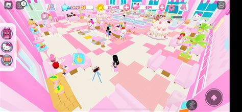 an image of a pink room with people in the middle and on the other side