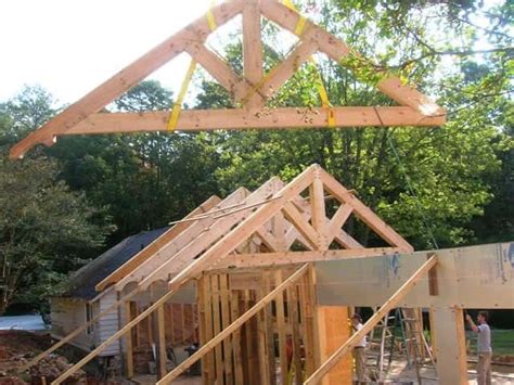 Timber frame trusses create an open and dramatic effect