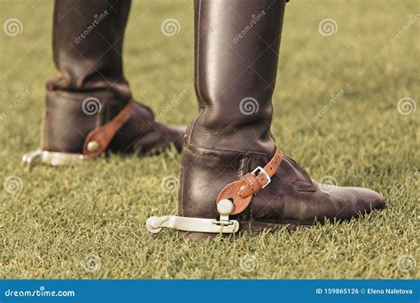 Sporting Brown Leather Riding Boots with Spurs on a Green Grass Stock Photo - Image of foot ...