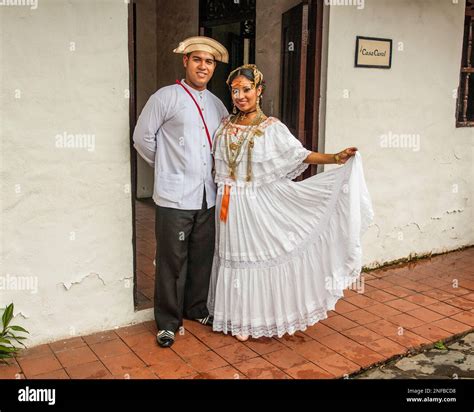 A Panamanian man and woman in traditional dress. The woman wears a ...