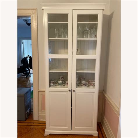 IKEA LIATORP Bookcase with Glass Doors in White - AptDeco