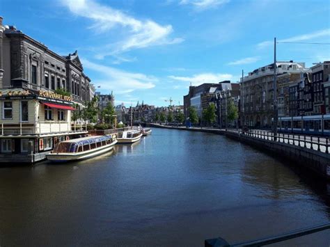 Amsterdam Walking Tour and Canal Cruise | GetYourGuide