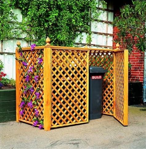 See here 14 great ideas to hide garbage and recycling container in your garden!