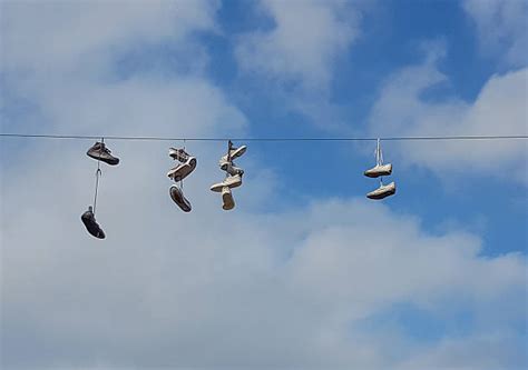 Shoes Hanging From Power Lines Stock Photos, Pictures & Royalty-Free ...