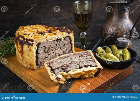 Traditional French Pate En Croute with Goose Liver with Gherkin and Pepperoni on a Modern Design ...