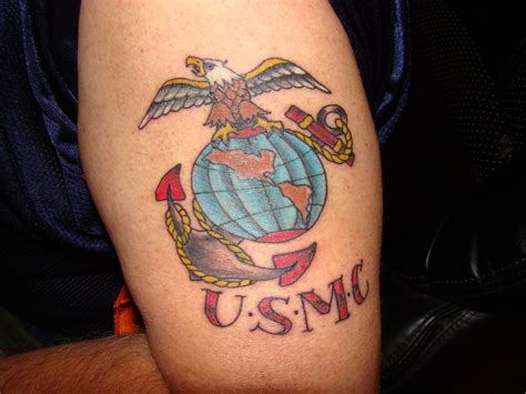 a tattoo with an eagle and globe on it