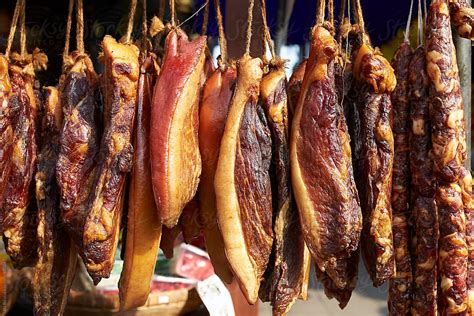 "Cured Meat On The Market During Chinese New Year" by Stocksy Contributor "Bo Bo" - Stocksy