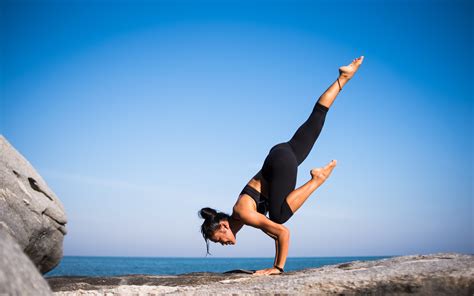 Low Angle View of Woman Relaxing on Beach Against Blue Sky · Free Stock ...