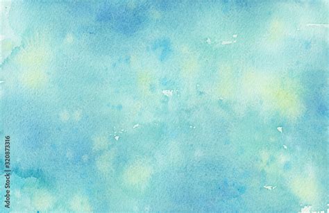 Pastel faded blue hand painted watercolor background design with paint bleed and fringing in ...