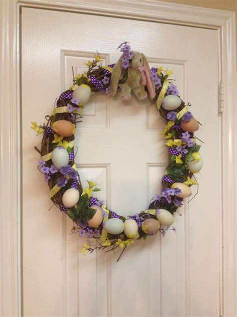 DIY Easter wreath made from a twig wreath (hobby lobby) Easter ribbon, yellow and purple flowers ...