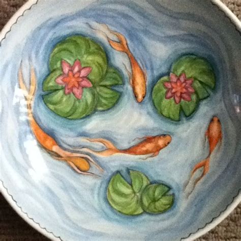 a bowl that has some water lilies in it