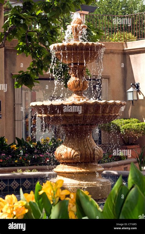 Spanish style tiered fountain patio courtyard Stock Photo - Alamy