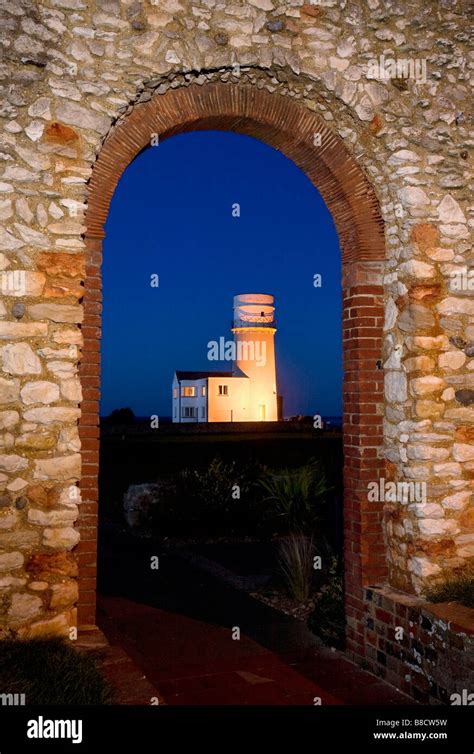 The Lighthouse at Old Hunstanton photographed at night through the arch way of the chapel of St ...