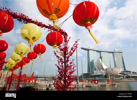 The Marina Bay Sands Singapore and Chinese New Year decorations on the waterfront. Marina Bay ...