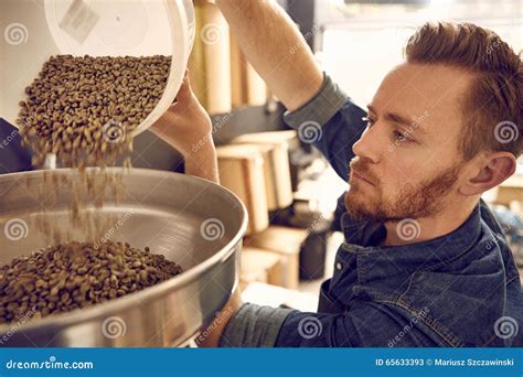 Man Pouring Coffee Beans into a Roasting Machine Stock Image - Image of preparation, automated ...