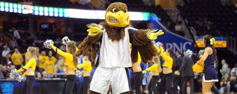 Flash, the mascot of the Kent State Golden Flashes,struts his stuff on the court at Quicken ...