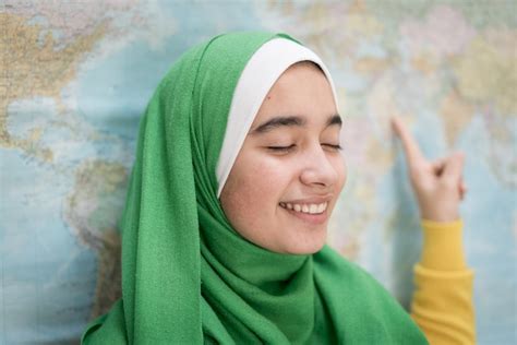 Premium Photo | Muslim girl with world map