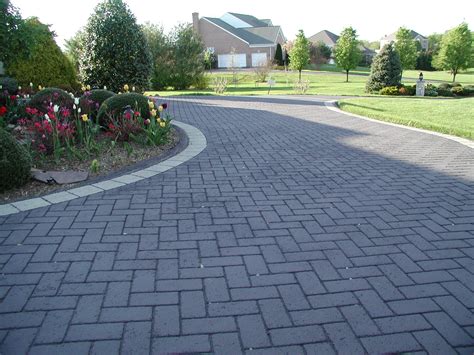 Beautiful landscaping and decorative driveways go hand-in-hand | Asphalt driveway, Driveway ...