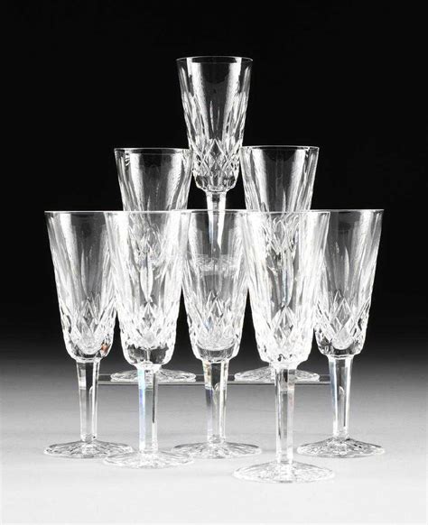 A SET OF EIGHT WATERFORD CUT CRYSTAL CHAMPAGNE FLUTES