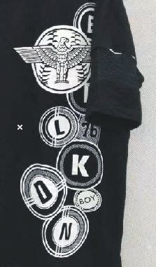 a black shirt with white letters and an eagle on it