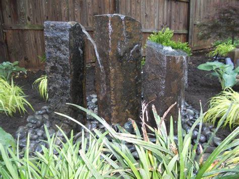 column water feature | Basalt Column Bubbling Water Feature. | Yelp | Backyard landscaping ...