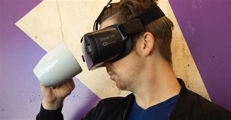 Man Wearing Virtual Reality Headset And Holding A Mug · Free Stock Photo