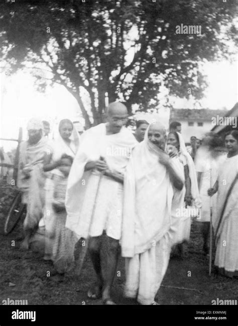 Mahatma Gandhi with the mother of Jamnalal Bajaj and other members of Bajaj family in Wardha ...