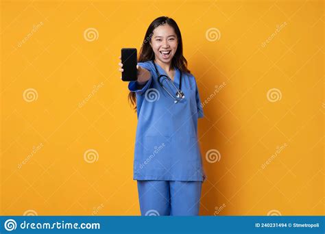 Asian Female Doctor in Uniform Showing a Mobile with a Happy Expression Stock Photo - Image of ...