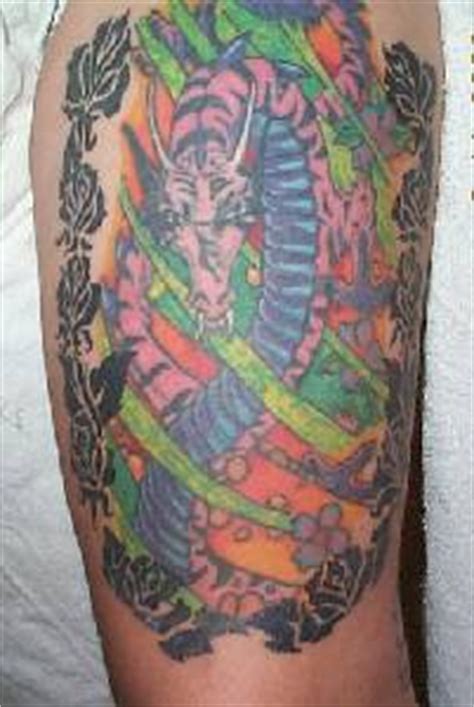 Colourful hydra dragon in roses tattoo - Tattooimages.biz