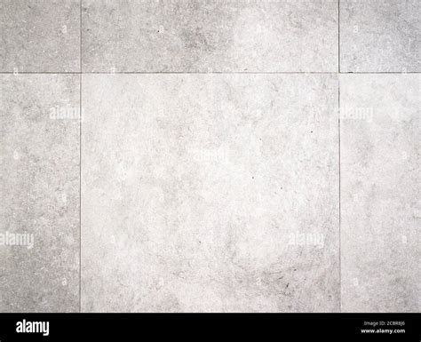 Light grey background texture of a concrete tile floor surface Stock Photo - Alamy