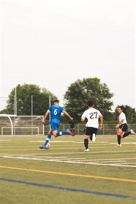 Soccer Players Playing at the Field · Free Stock Photo