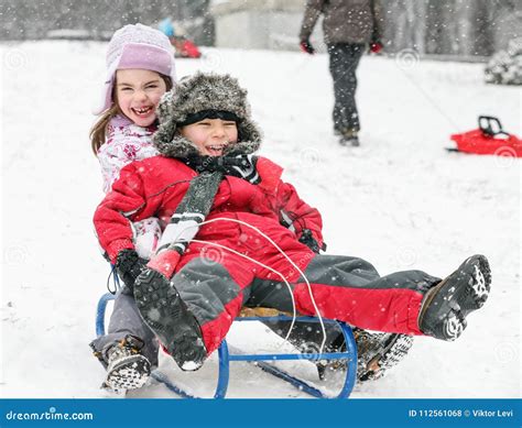 Kids Sledding Fun Snow stock photo. Image of sibling - 112561068