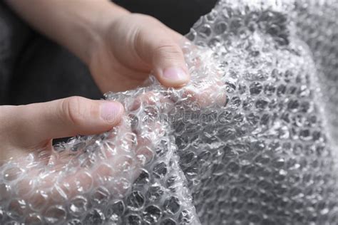 Boy Popping Bubble Wrap, Closeup. Stress Relief Stock Photo - Image of ...