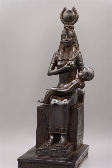 Ancient Egyptian statue of goddess Isis breastfeeds her son Horus made ...